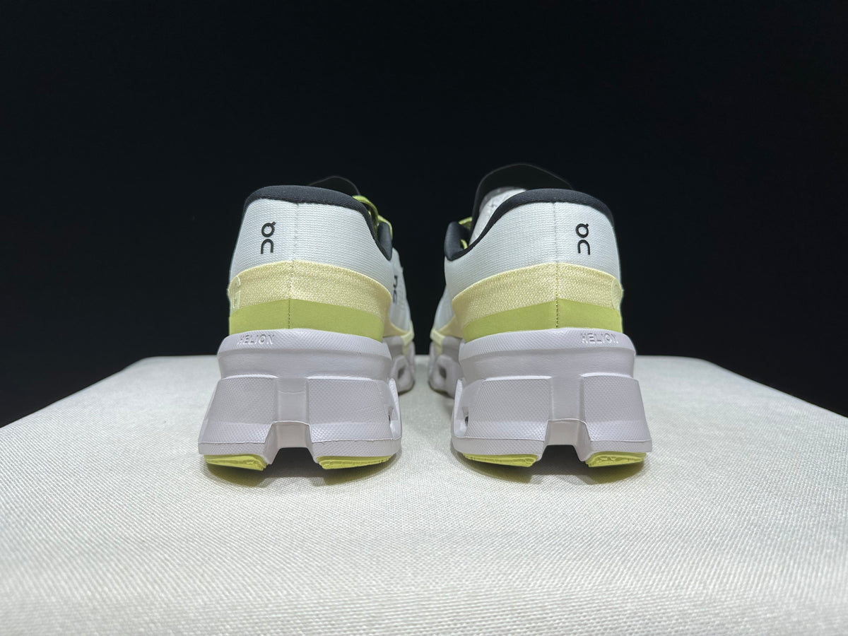 Rear view of the Cloudmonster 2 shoes showing the heel details and lime accents.