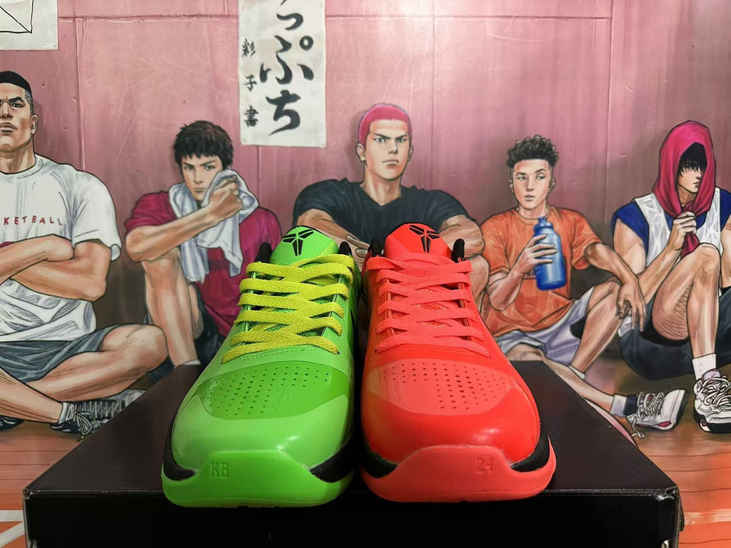 Front views of the red and green basketball shoes with matching laces and perforated toe areas.