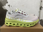 Side view showing CloudTec lettering and a lime-green sole