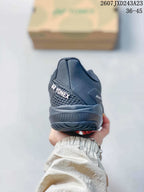 Rear view of the dark Yonex tennis shoe showing the padded heel and Yonex branding.