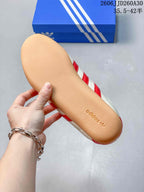 Close view of the gum-colored sole on an adidas Originals Tokyo MJ sneaker.