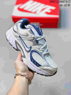 White and blue Nike V5 RNR sneaker with blue mesh panels and a white midsole.