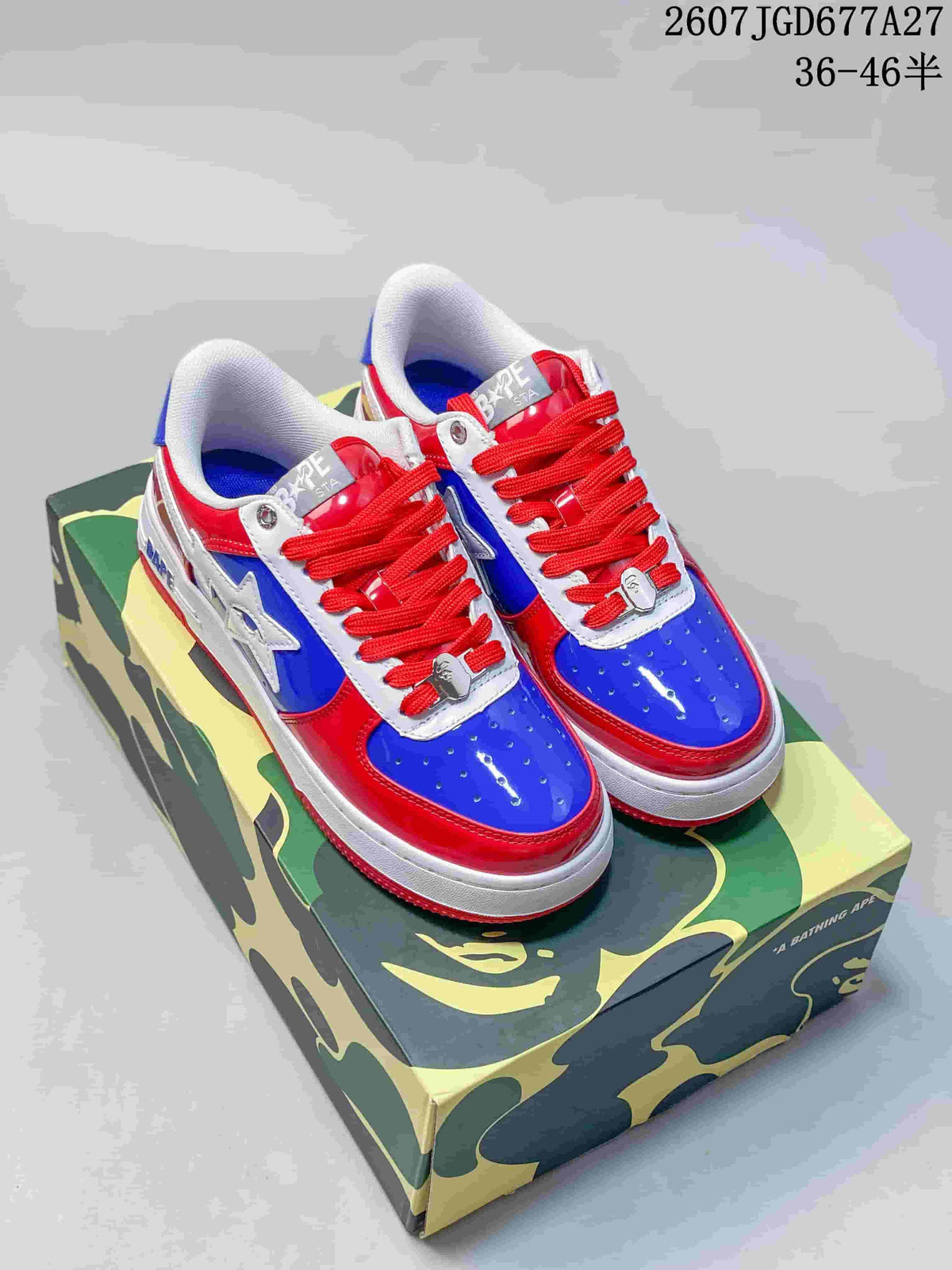 Pair of red, blue, and white BAPE STA low-top sneakers displayed on a camouflage shoe box; image text shows style code 2607TGD677A27 and size range 36–46.5.