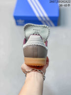 Rear view showing the gray heel, burgundy collar lining, and gum outsole.