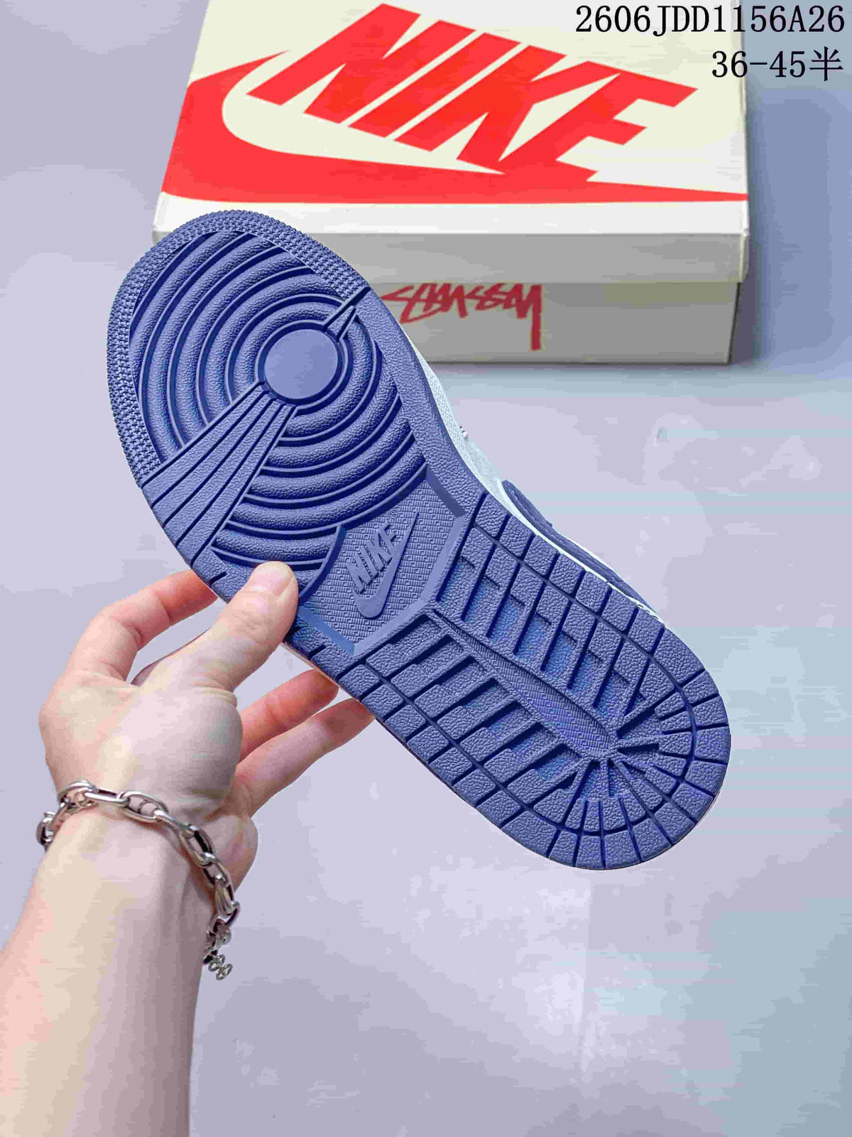 Close-up of the blue rubber outsole showing concentric circular traction rings and molded tread sections.