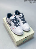 Pair of white and black Nike low-top sneakers displayed on a branded shoe box, with product code and size range text visible above.