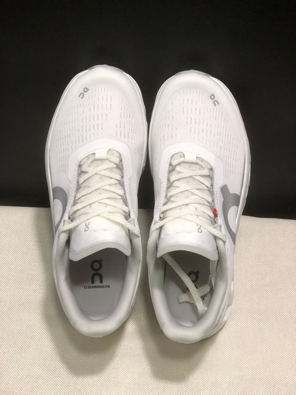 Top-down view showing the laces, patterned uppers, and branded insoles.