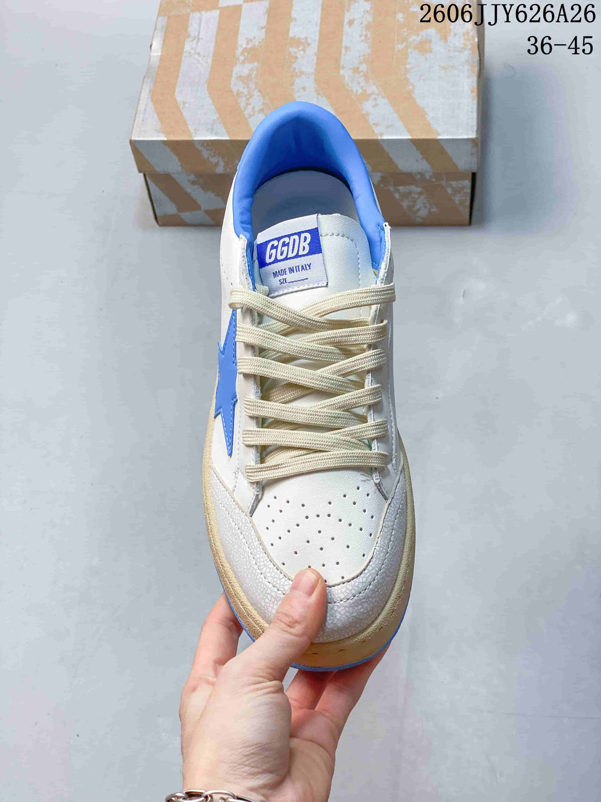 Top view showing the perforated toe box, cream laces, blue collar, and GGDB tongue label.
