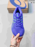 Top view of the purple sneaker showing the perforated knit-mesh toe box, laces, and lime accents.