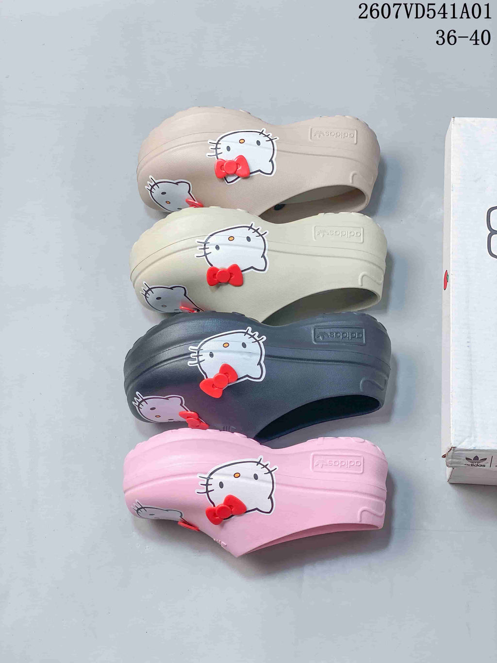 Four color options of Hello Kitty platform mule clogs shown from the side.