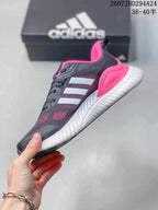 Side view showing the mesh-style upper, contrasting stripes and thick white midsole.