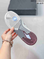Underside view of the sneaker showing the patterned rubber outsole and adidas branding.