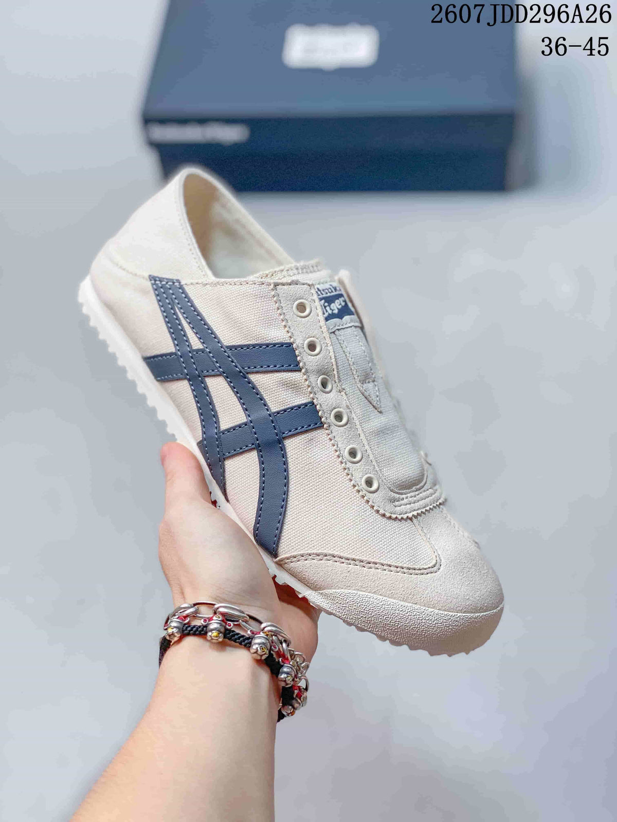 Off-white Onitsuka Tiger Mexico 66 slip-on sneaker with navy blue side stripes and a light textured outsole.