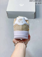 Rear view of a beige and white Nike Air Force 1 '07 sneaker