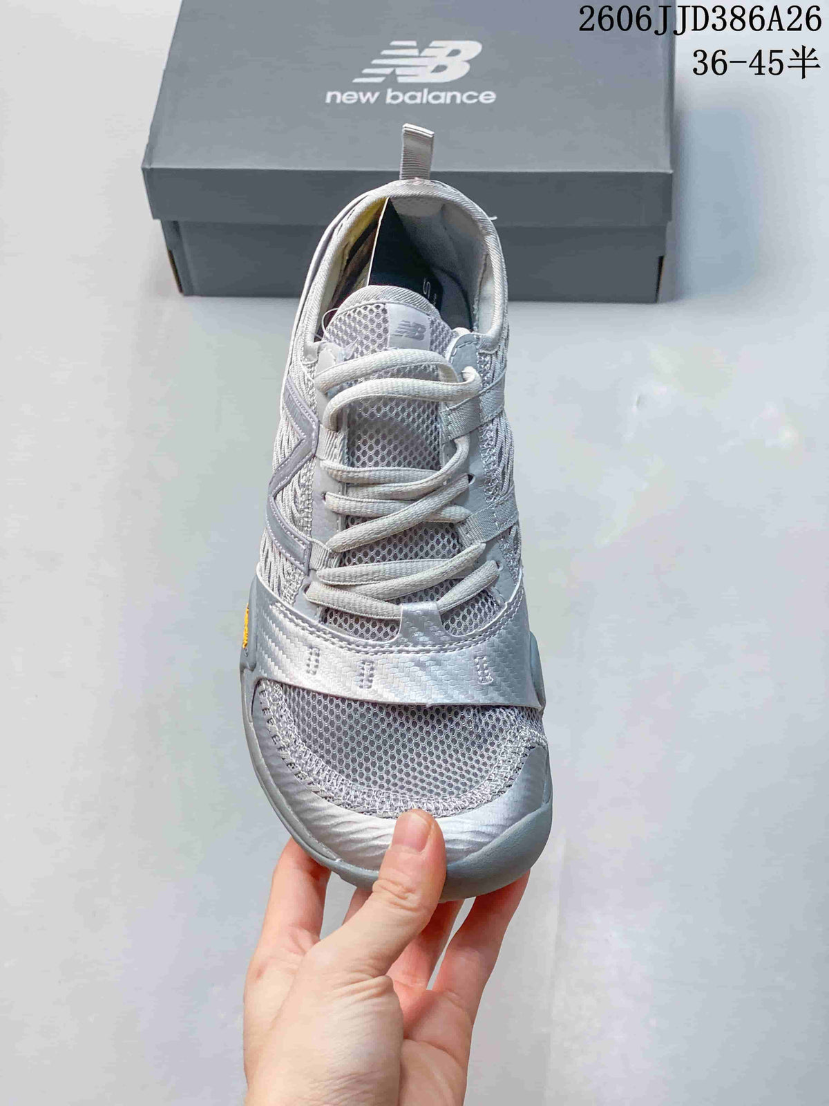 Front view showing the mesh-style toe area, laces, and gray-and-white color scheme.