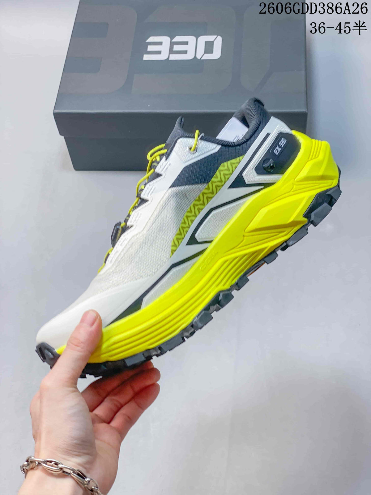 Side view of a white and neon yellow Kailas FUGA EX330 trail running shoe