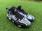 Front three-quarter view of white and black Jordan basketball shoes with patterned side panels