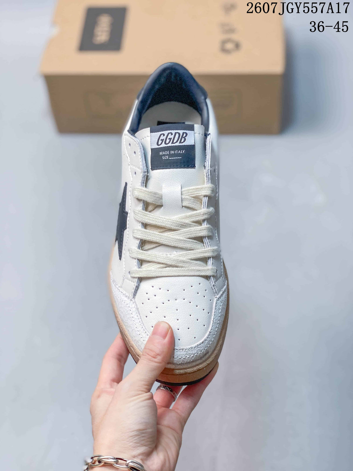 Front view of the white lace-up sneaker showing perforated toe panels, cream laces, dark lining, and tongue branding.