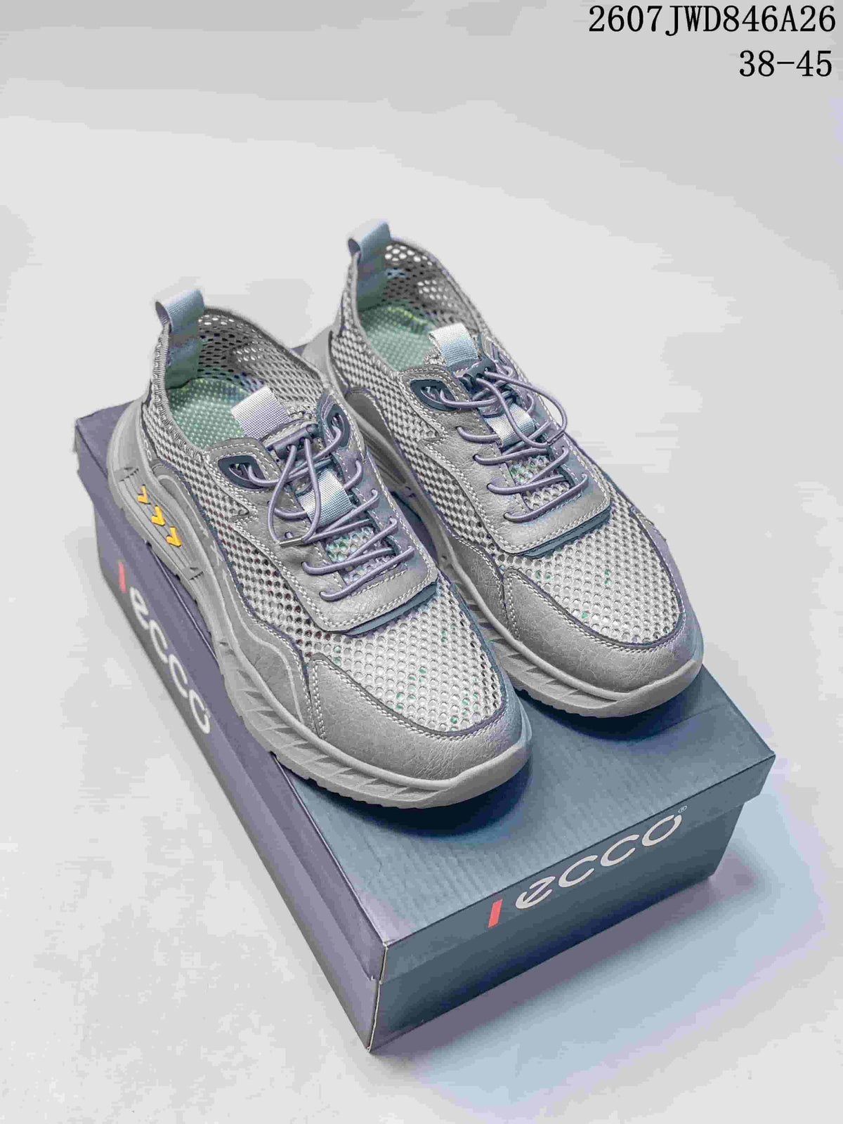 Pair of grey ECCO sneakers displayed on a branded shoebox, showing the mesh upper, lace-up front and style code 2607JWD846A26.