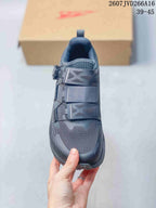 Top view showing the rounded toe, breathable-looking textile upper, layered forefoot straps, and BOA dial on the side.