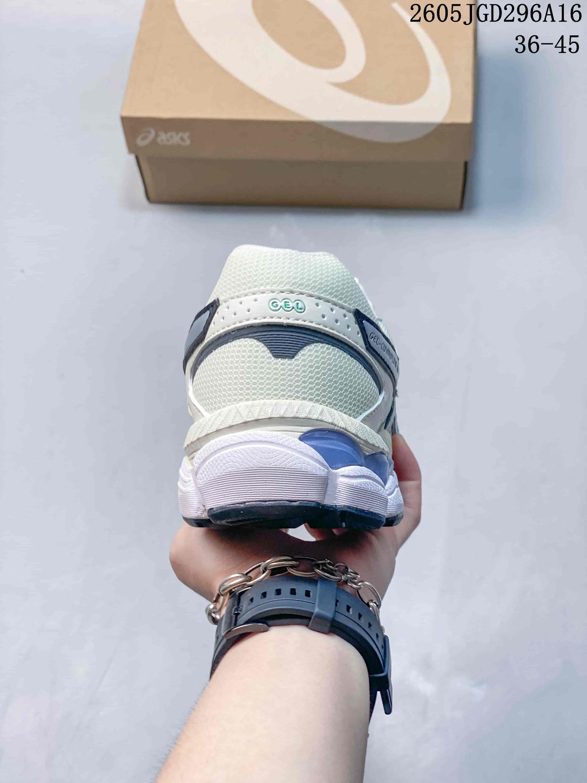Rear view of the white ASICS Gel-Cumulus 16 sneaker with layered heel and outsole details