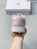 Rear view showing the pale pink heel panel and embroidered Jordan Wings detail.