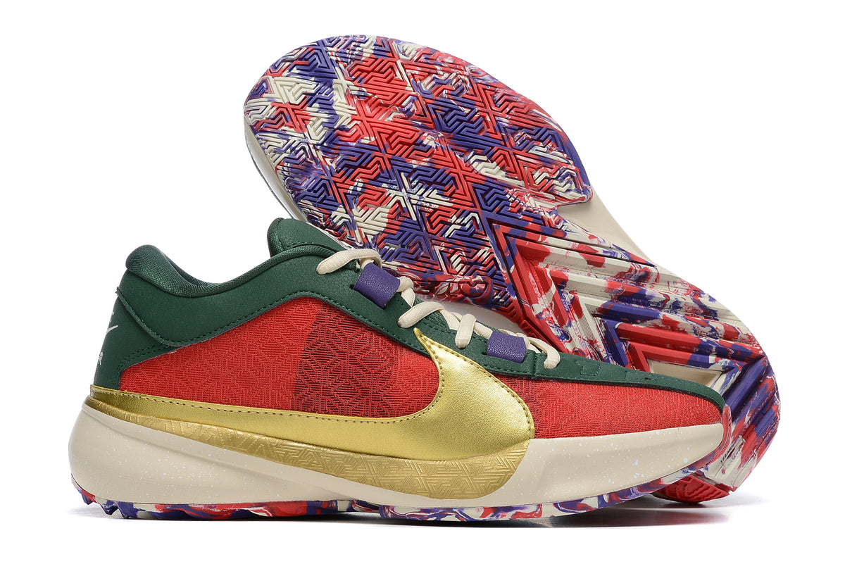 Red and dark green basketball shoes with a gold Swoosh and a multicolor patterned outsole.