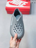 Top view of the gray clog showing the perforated upper and open slip-on collar.