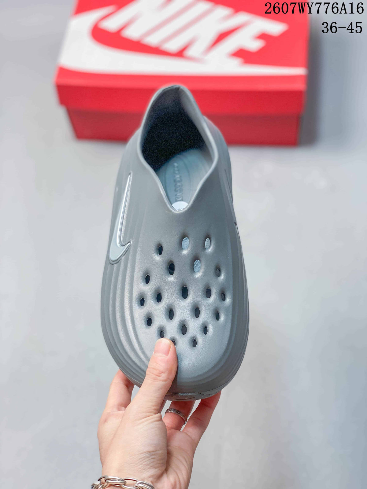 Top view of the gray clog showing the perforated upper and open slip-on collar.