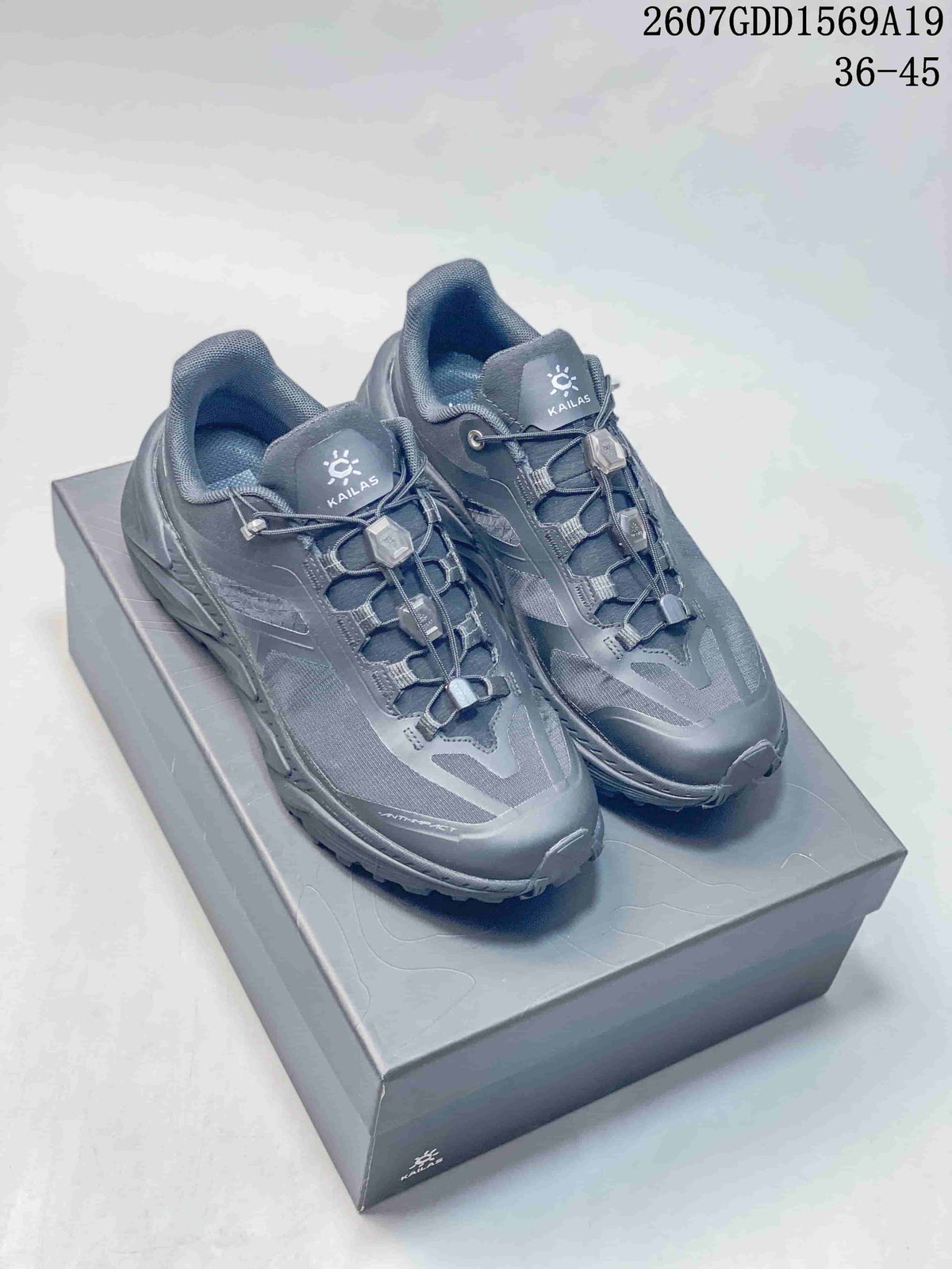 Pair of dark gray KAILAS outdoor shoes displayed on a box, showing mesh panels, cord-lock lacing, and protective toe areas; overlay text shows code 2607GDD1569A19 and sizes 36–45.
