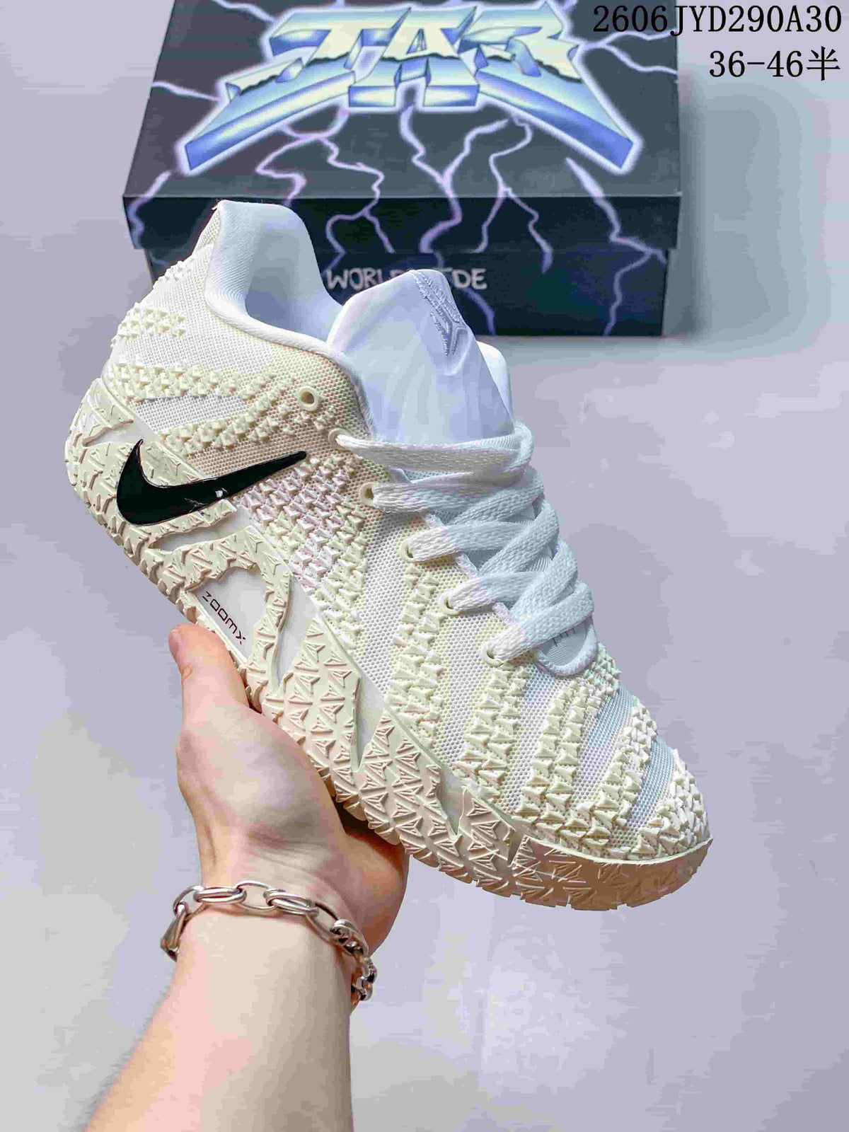 Cream Nike Ja 3 basketball shoe with a black accent