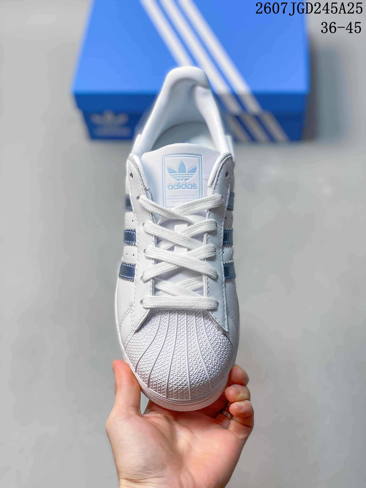Front view showing the lace-up design, shell toe, and adidas tongue label.