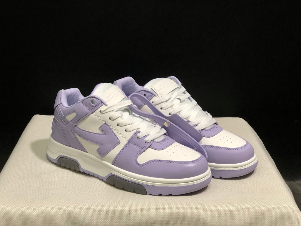 Front three-quarter view of the pair with lavender overlays, white uppers, and contrasting soles.