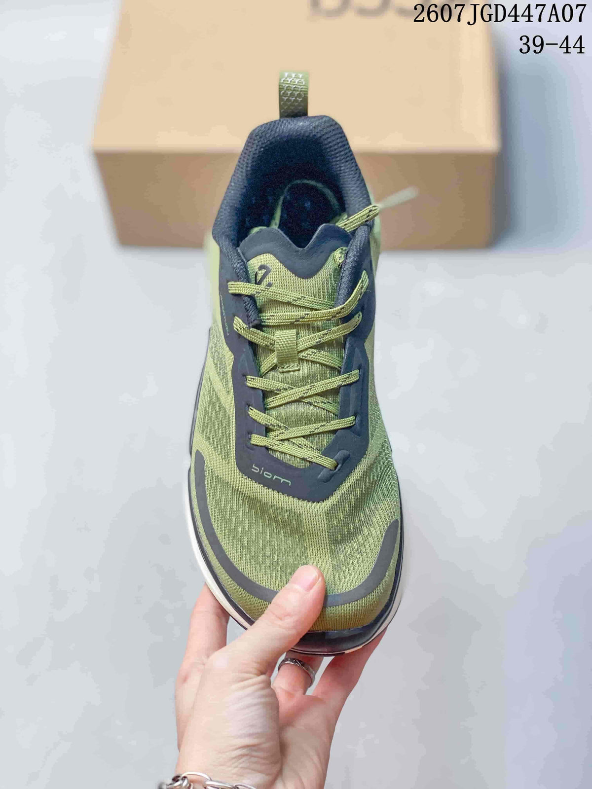 Front view showing the green mesh-style upper, navy overlays, green laces, and rounded toe.