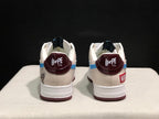 Rear view of the pair showing burgundy Bape Sta heel panels, white padded collars, and contrasting heel graphics.
