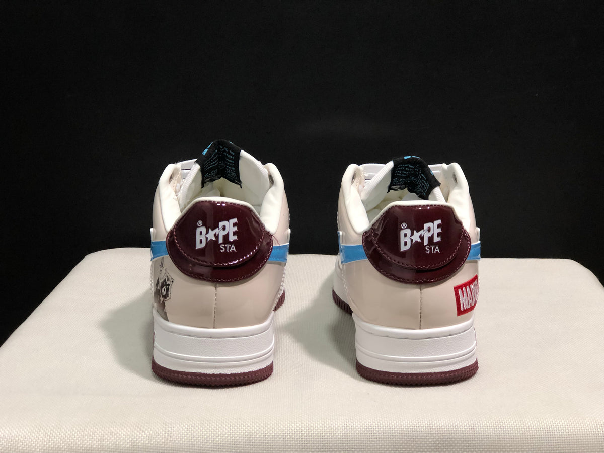Rear view of the pair showing burgundy Bape Sta heel panels, white padded collars, and contrasting heel graphics.