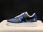 Side view of one blue and gray low-top sneaker with a black star detail and white outsole.