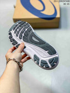 Close-up of the patterned outsole showing dark rubber traction sections and a white midsole.