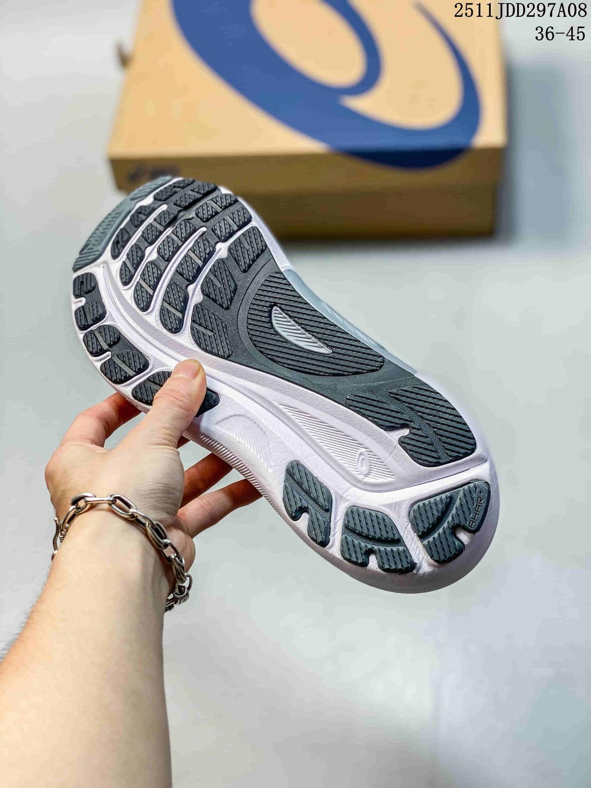 Close-up of the patterned outsole showing dark rubber traction sections and a white midsole.