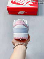 Rear view of the sneaker showing pale blue and pink heel details