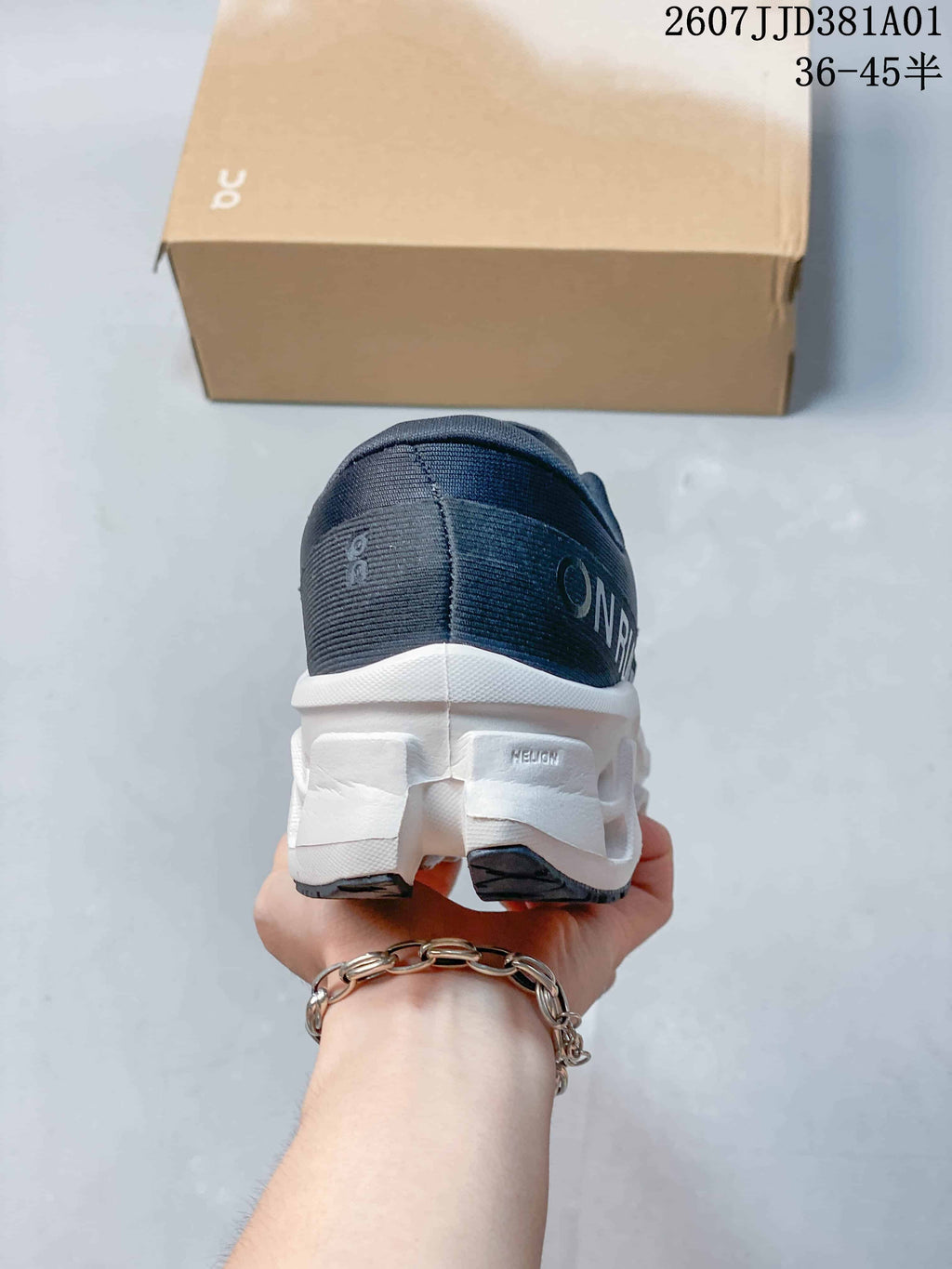 Rear view of the shoe showing the heel and white sculpted sole.