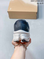 Rear view of the shoe showing the heel and white sculpted sole.