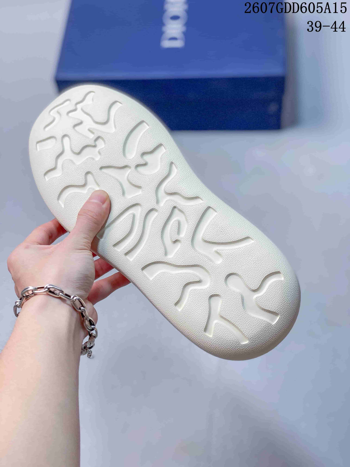 Close-up of the cream outsole showing its molded patterned tread.
