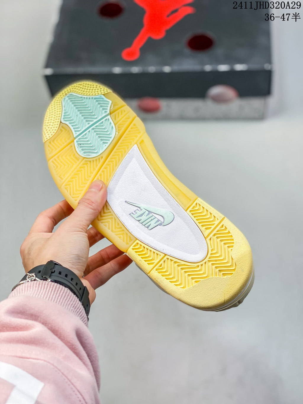 Close-up of the patterned yellow rubber outsole and central traction panel