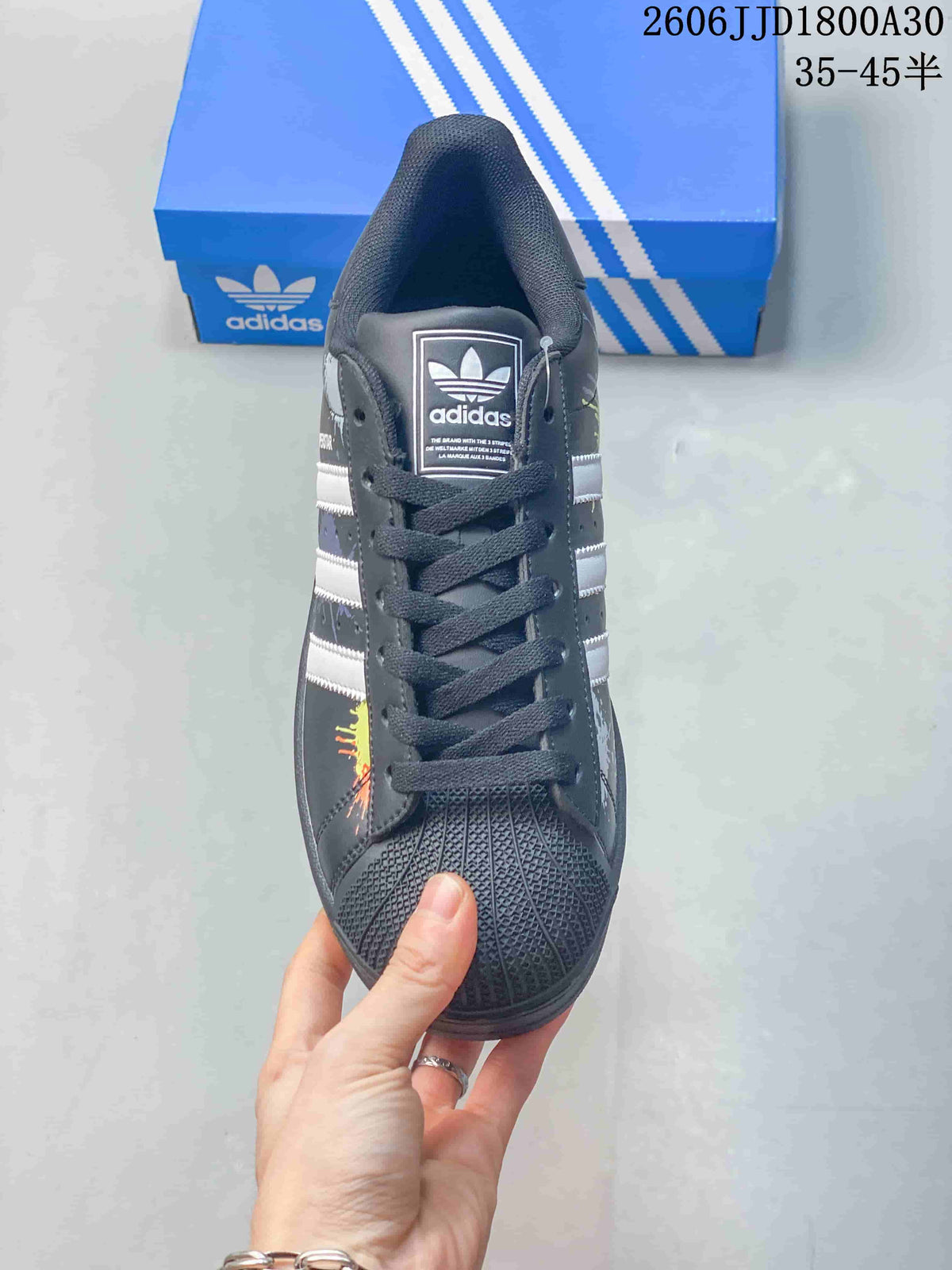 Front view showing the laces, textured shell toe, and tongue logo.