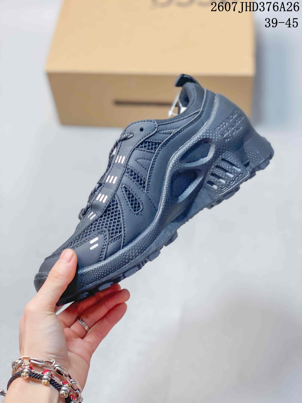 Side view of the sneaker showing mesh panels, layered overlays, lace system, and textured sole.