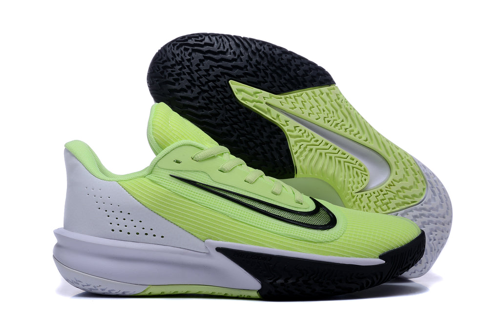Nike basketball shoes shown with the patterned black, volt yellow-green, and white outsole visible.