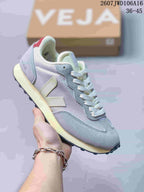 Light gray and pastel VEJA Rio Branco sneaker with white laces and contrasting V branding.