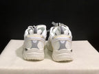 Rear view of the pair showing padded collars, pull tabs, heel detailing, and textured outsoles.