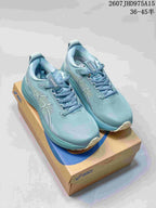 Pair of blue-teal ASICS Gel-Kayano 33 sneakers displayed on an ASICS shoe box.